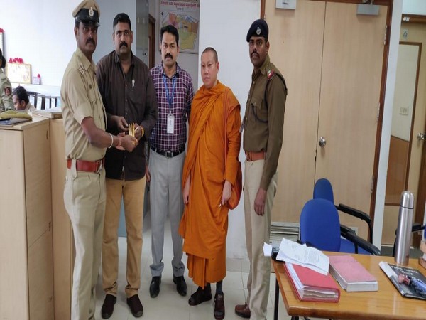 Local police with the arrested Cambodian national (Photo/ANI)