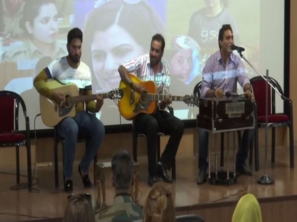 Artists performing during a program in Srinagar on Thursday. [Photo/ANI]