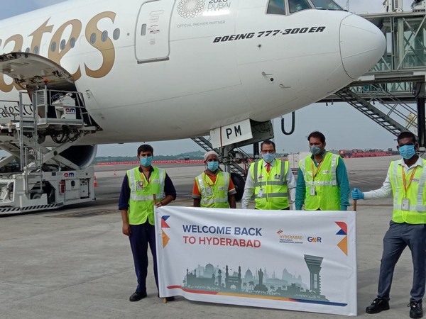 GMR Hyderabad International Airport staff welcome passengers from Dubai. 