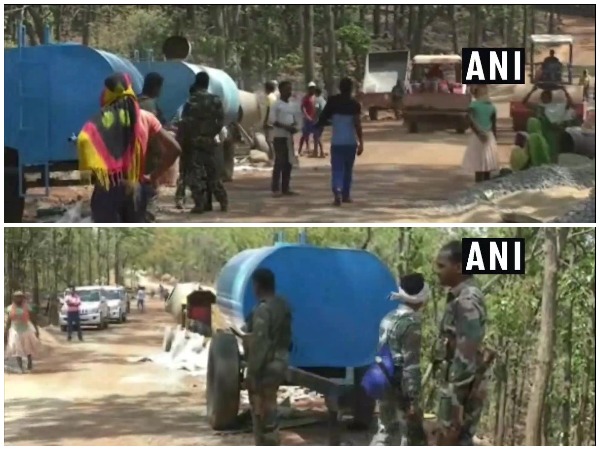 Construction of road underway in Naxal-affected area under CRPF and police security in Balrampur.
