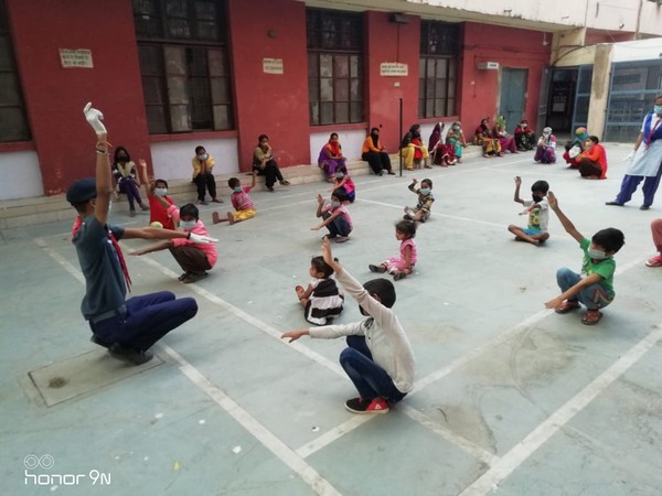 Children at a shelter home sitauted in Rajkiya Pratibha Vikas Vidyalaya, Ashoka Pahari, Delhi doing exercise on Saturday [Photo/ANI]