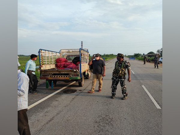 Police and CRPF personnel checking vehicles in the Kottapalli cross-road