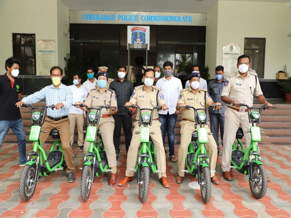 Cyberabad Police personnel with the e-scooters. (Photo/ANI)