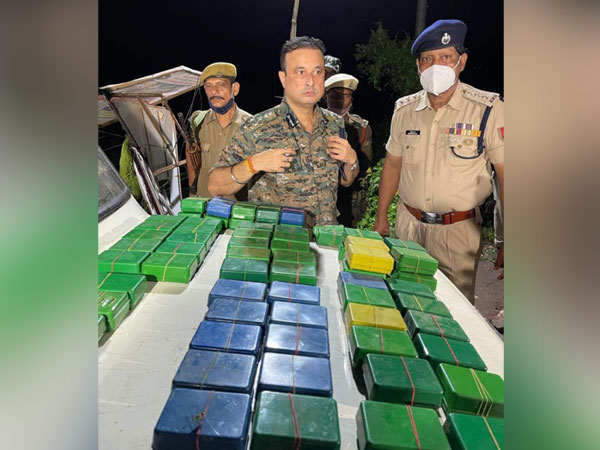Assam Police with seized consignment of drugs. (Photo/ANI)
