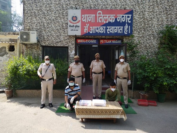 Delhi Police with the two accused for black marketing of Remdesivir injections. 