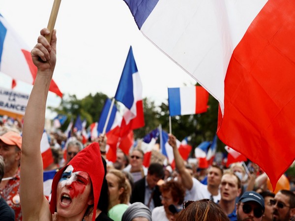 Protesters attend a demonstration against France's restrictions, including a compulsory health pass, to fight the coronavirus disease (COVID-19) outbreak, in Paris, France on Saturday.