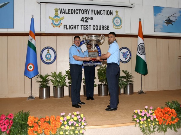 Air Marshal AS Butola, Air Officer Commanding-in-Chief, Training Command, felicitating a graduate in Bengaluru on Friday.