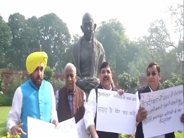 AAP leaders protesting in front of Gandhi statue in the Parliament on Wednesday. (Photo/ANI)