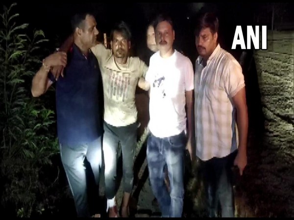 The person arrested by Ghaziabad Police (second from left) (Photo/ANI)