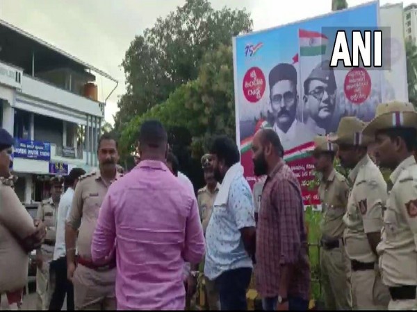Visual of Congress workers requesting police to remove Savarkar posters in Udupi (Photo/ANI)