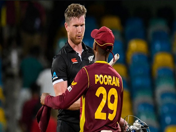 Pooran with James Neesham (Image Source:ICC)