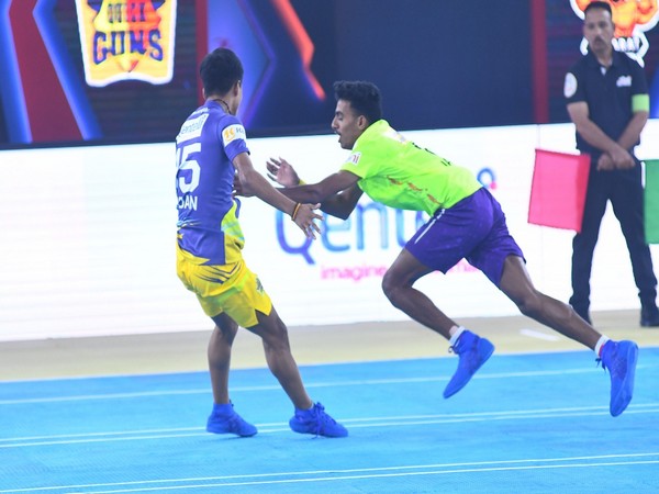 Gujarat Giants' Jaggannath Das (in Green) dismisses a player during an Ultimate Kho Kho match against Chennai Quick Guns