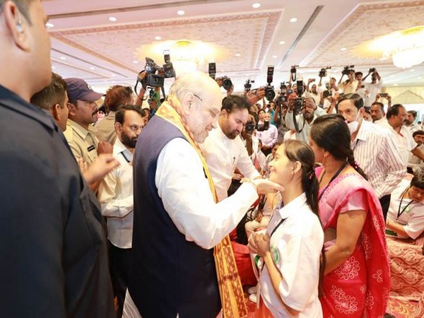 Home Minister Amit Shah interacting with a specially-abled child. (Photo/PIB)