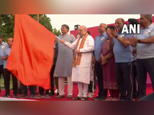 Union Home minister Amit Shah flags off PM Modi cross-country slum run at Dhyan Chand National stadium (Photo/ANI)