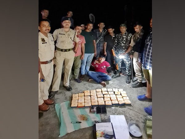 Assam Police team with accuse and seized heroin 