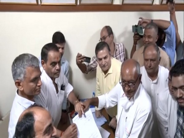 Digvijaya Singh holding his nomination form (Photo/ANI)
