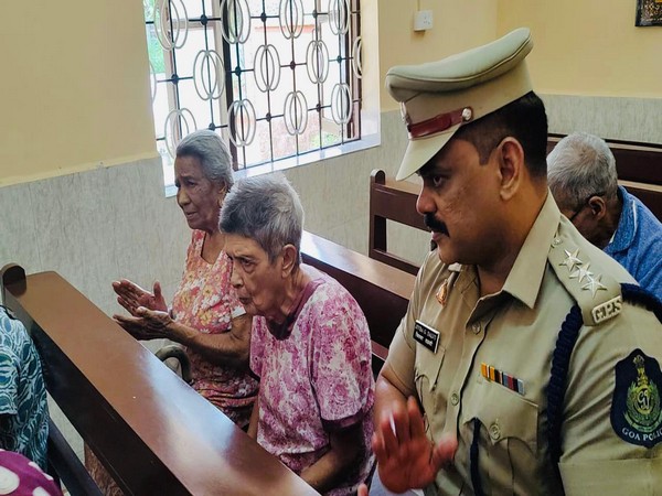 Mapusa Police officer with old age people 