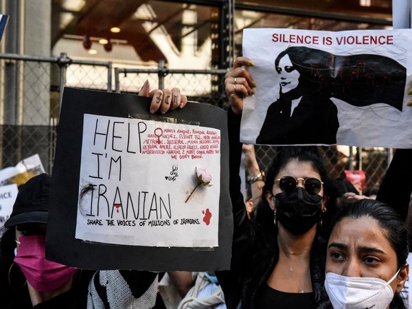 People participate in a protest against the Islamic regime of Iran and the death of Mahsa Amini in New York City (Photo Credit: Reuters) 