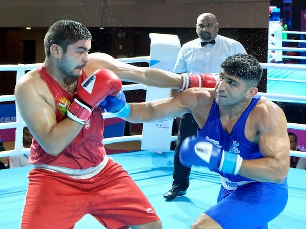 Boxer Sanjeet (blue) in action during the 36th National Games (Image: SAI/MYAS media)