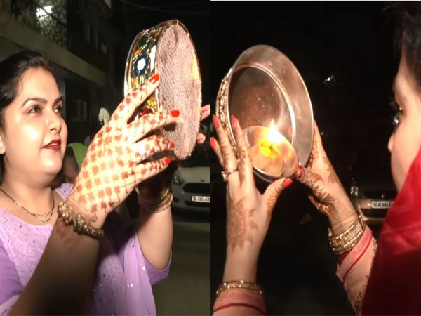 Women in Delhi's Lajpat Nagar celebrating Karwa Chauth