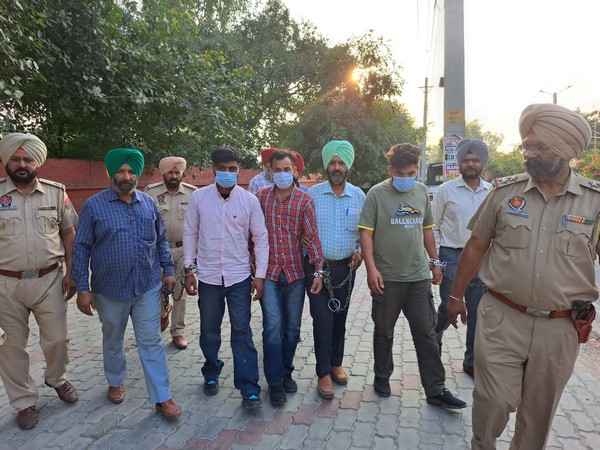 Punjab Police with arrested operatives 