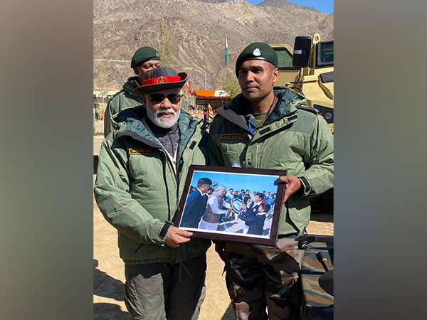 Prime Minister Narendra Modi with Major Amit Kumar in Kargil (Photo/ANI)