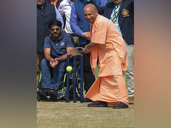 CM Yogi Adityanath playing cricket. (Photo- UP CMO)