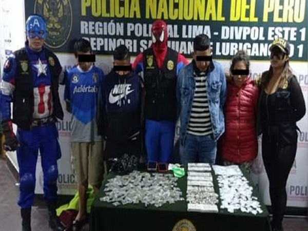 Officials dressed as Superheroes with nabbed drug peddlers (Image source: Twitter @TheOgwingman619)