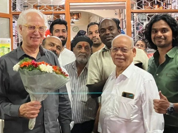 Zev Seigl with employees at Bengaluru restaurant (Image Source: Instagram)