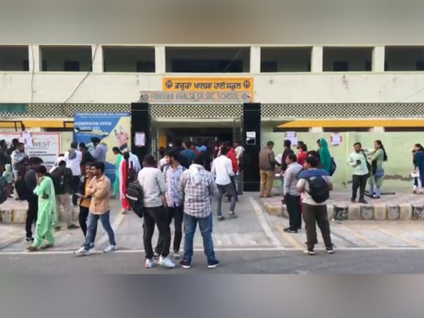 Examinees gathered outside examination centre