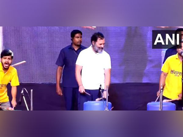 Congress MP Rahul Gandhi trying his hands at a drum. (Photo/ANI) 
