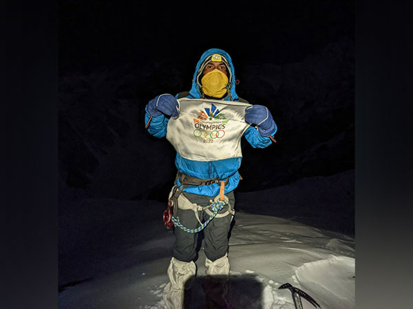 Chaman Lal Kose with the flag after reaching the summit. (Photo/ANI)