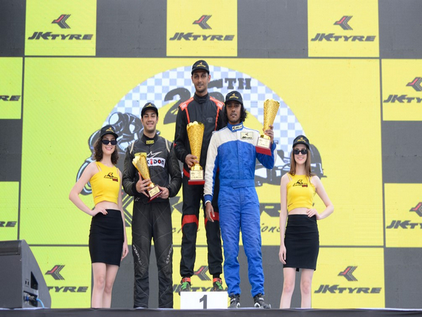 Raghul Rangasamy (Centre) after winning LGB Formula 4 of the 25th FMSCI National Racing Championship (Image: FMSCI)