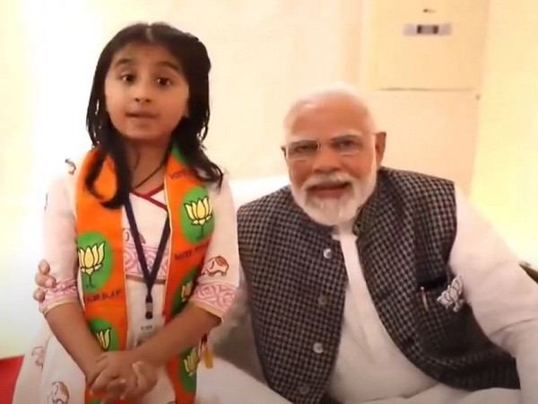 PM Modi met his small supporter in Rajkot (Photo/ANI)