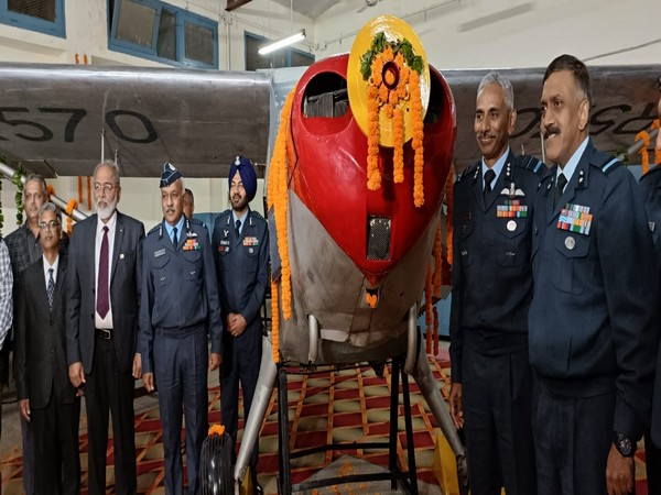 IAF and PEC officials with the vintage Kanpur-I aircraft (Photo/ANI) 