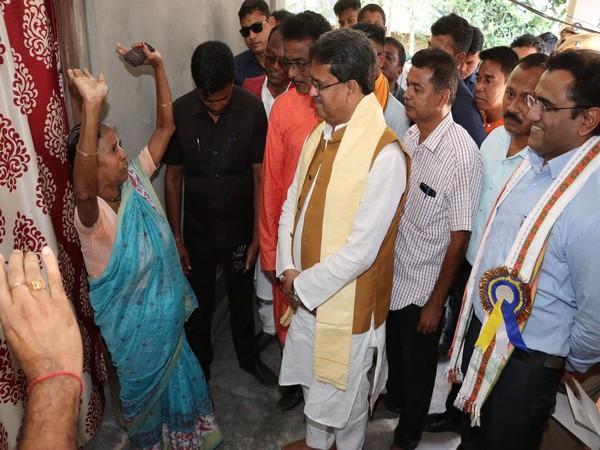 Tripura CM Dr Manik Saha interacts with a beneficiary in Dhanpur (Photo/ANI)
