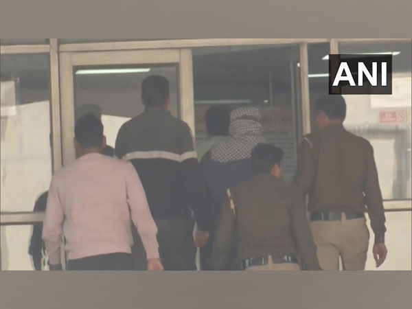 Aftab with his face covered with black and white cloth (Photo/ANI)