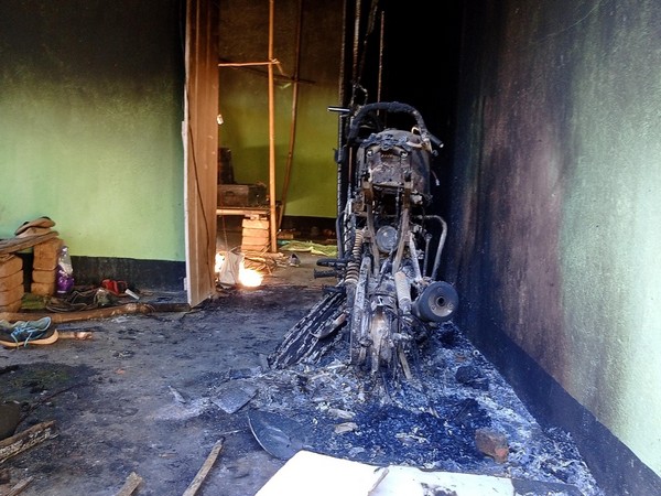 Charred remains of a bike after a group of villagers allegedly burnt down a forest office after a firing incident that occurred along the Assam-Meghalaya border. (ANI/photo)