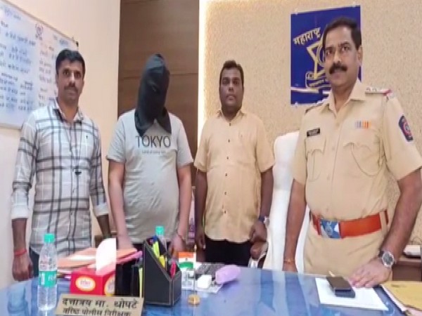 Arrested social media influencer with Maharashtra Police (Photo/ANI)