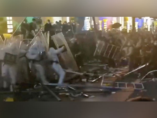 Security forces clash with workers during a protest outside Apple supplier Foxconn's factory in Zhengzhou. (Photo Credit - Reuters)