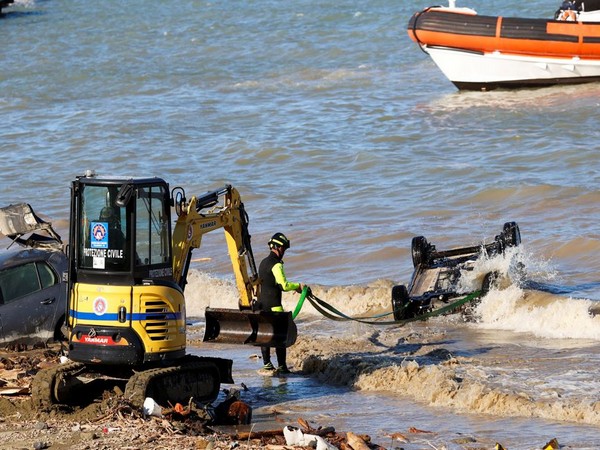 Rescue team members remove a car from water following a landslide on Italy's Ischia Island. (Photo: Reuters)