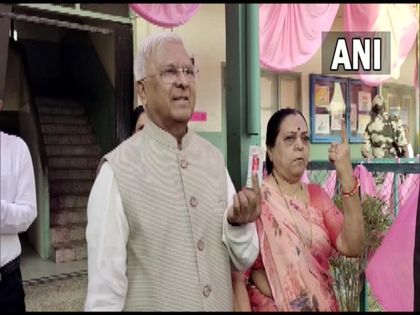 Madhya Pradesh Governor Mangubhai Patel and his wife cast their votes (Photo/ANI)