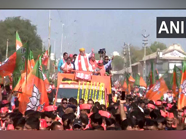 Union Home minister Amit Shah holds a roadshow in Sanand in Ahmedabad. (Photo/ANI)