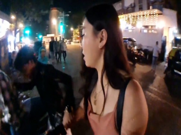 Youth holding Korean women hands (Screengrab from the viral video)