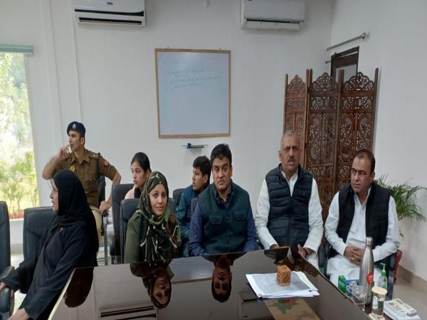 SP leader Irfan Solanki during his surrender at Kanpur Police Commissioner's camp office with his wife and SP leader Amitabh Bajpai, Hashan Rumi (Photo/ANI)