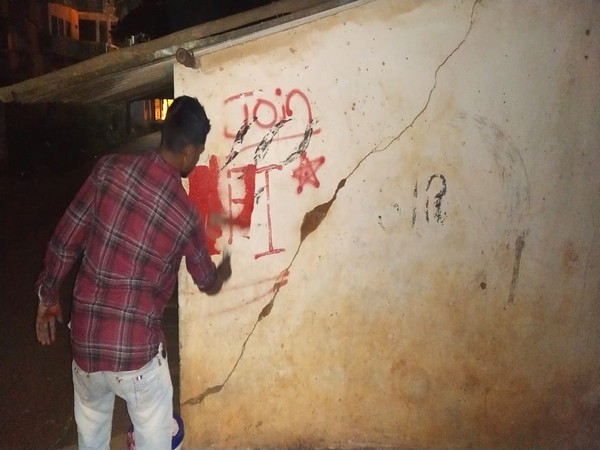 Graffiti being removed at Shivamogga.