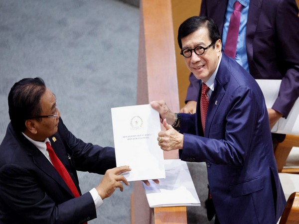 Indonesian Human Rights Minister Yasonna Laoly receives new criminal code report in Jakarta. (Photo Credit: Reuters)
