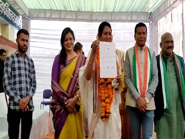 Congress Candidate Savitri Mandavi holding election certificate after victory in Bhanupratappur by poll (Photo/ANI)