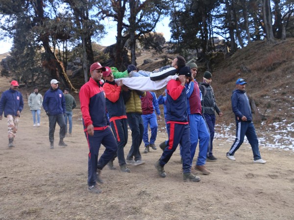 ITBP jawans carrying injured trekker in Auli