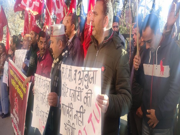 Workers protest the shutdown of two cement factories in Shimla.